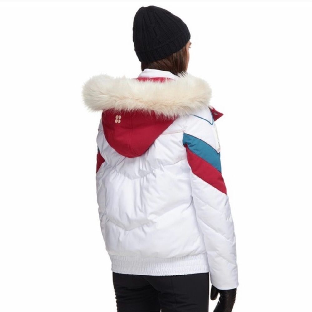Sweaty Betty White Jacket with Red and Blue Accents. Detachable faux Fur Hood.